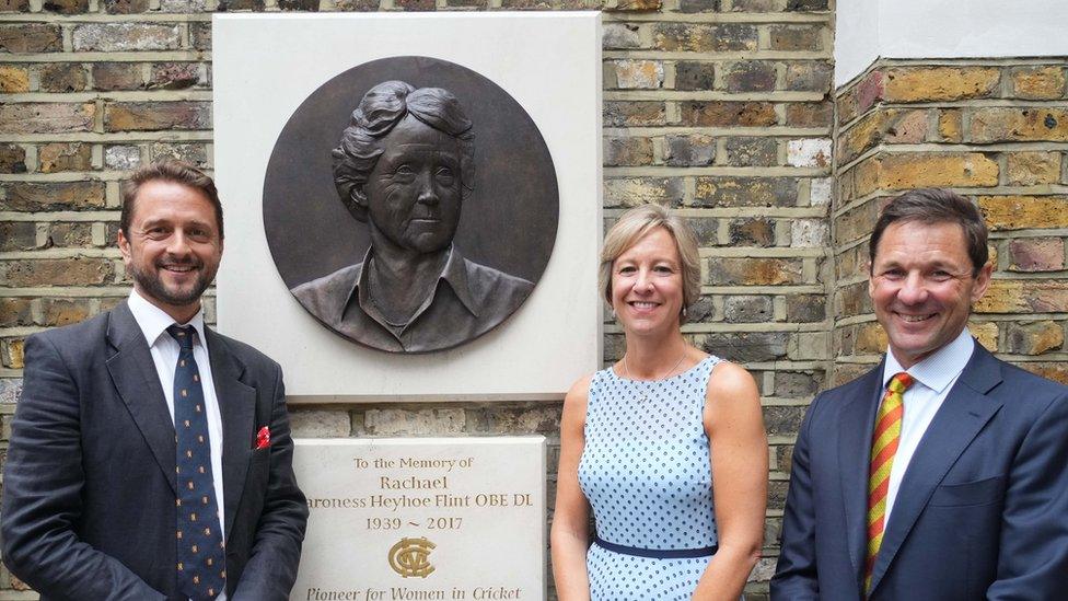 Ben Heyhoe Flint, Clare Connor and MCC chief executive Guy Lavender with a plaque and sculpture of Rachael Heyhoe Flint