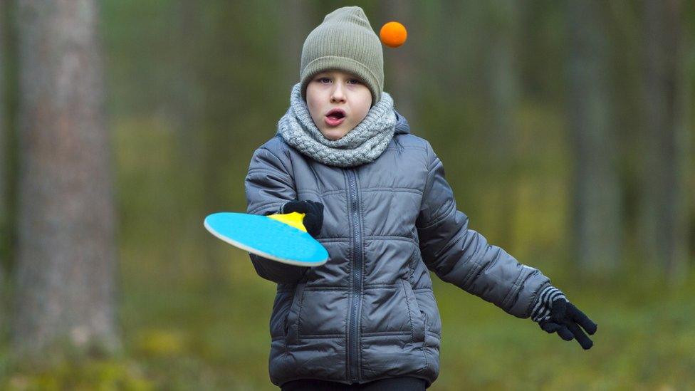 Boy playing tennis