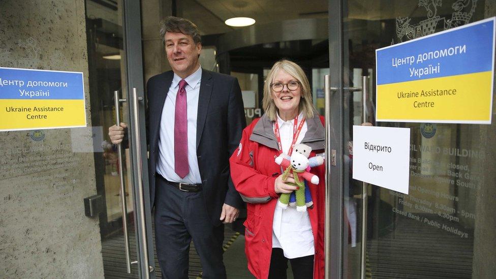 Staff open the doors of the new Ukraine Assistance Centre