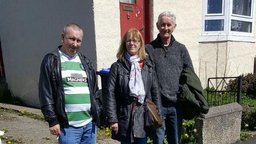 Tommy Chalmers (left), Pat McBain (centre) and Robert Weston (right) outside the house in Turriff where their father lived