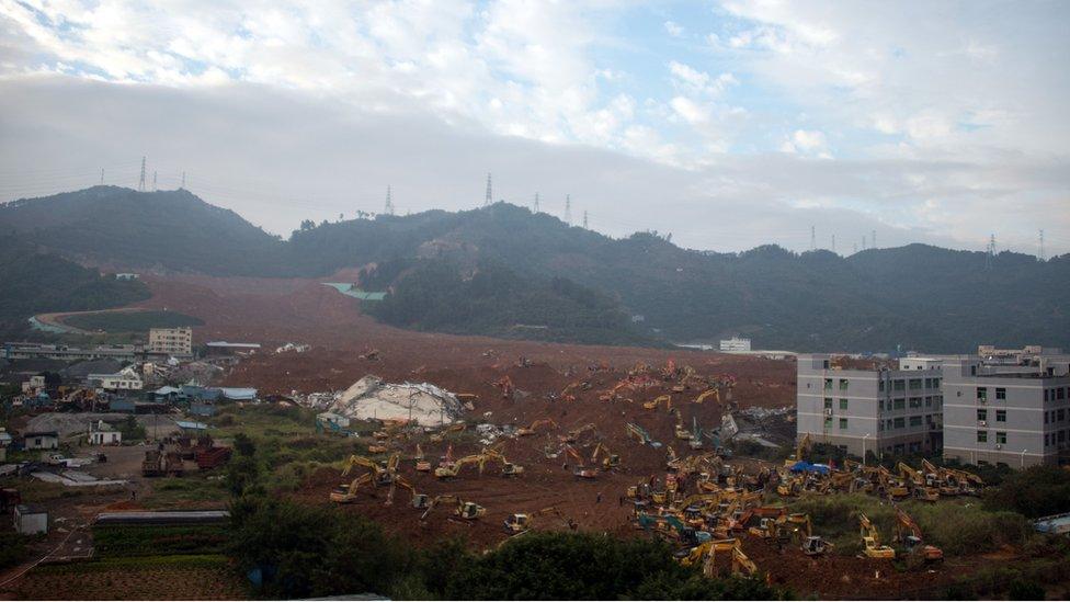 Rescue workers look for survivors after a landslide hit an industrial park in Shenzhen, south China's Guangdong province on 22 December 2015