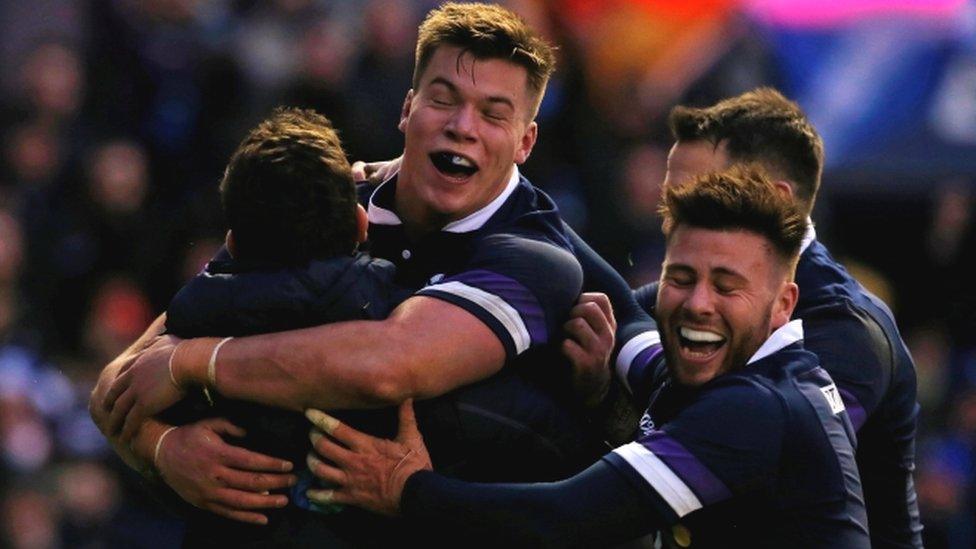 Scotland celebrate one of their eight tries against Australia