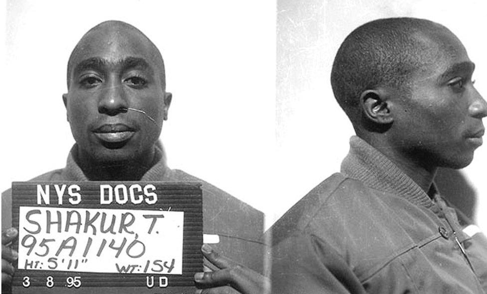 Tupac Shakur poses for a mug shot for the New York State Department in 1995