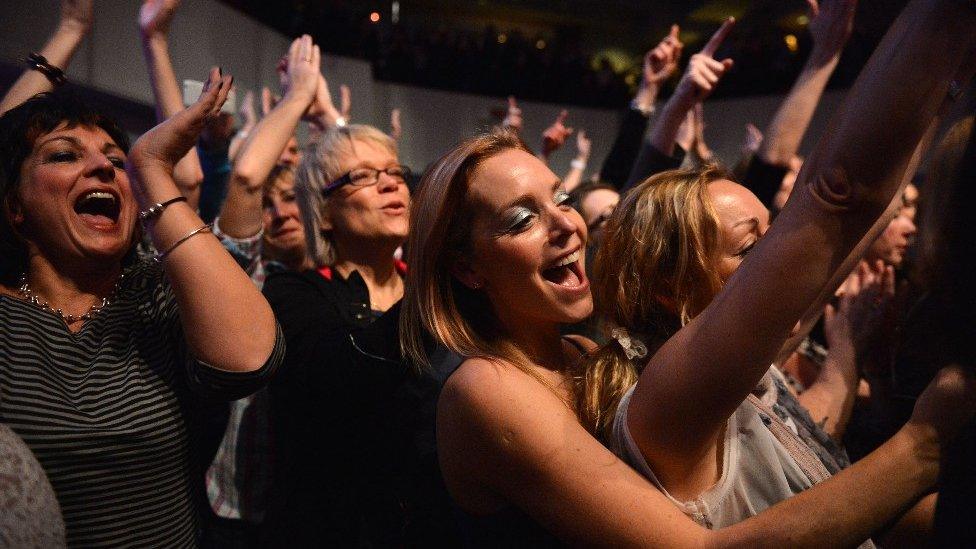 An audience watching Gary Barlow in concert