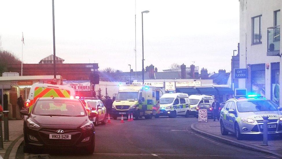 Police vehicles outside Forest Hill station