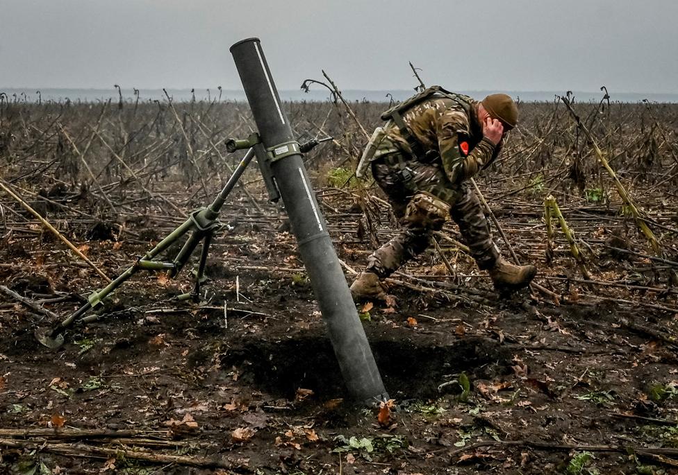 A Ukrainian serviceman fires a mortar on the front line in the Zaporizhzhia region, Ukraine, 16 November 2022.