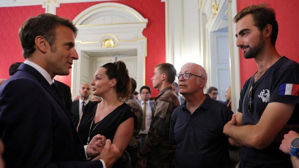 President Emmanuel Macron meets Henri, the so-called "hero with a backpack", in Annecy