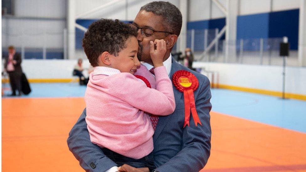 Vaughan Gething celebrates with his son Isaac, aged 6