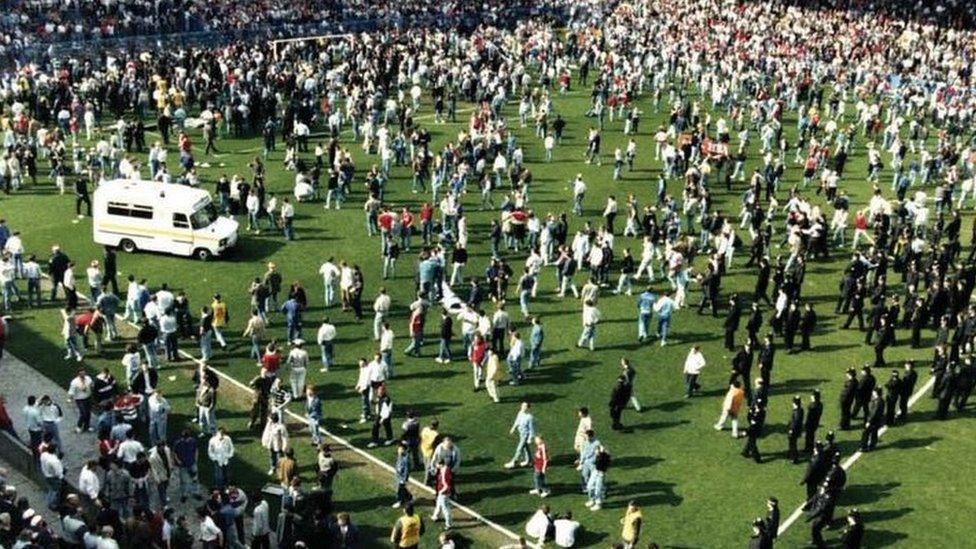 ambulance on crowded pitch