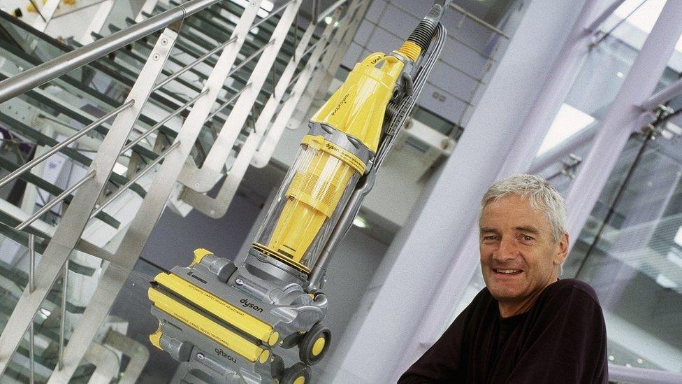 James Dyson with an early vacuum cleaner in 2002