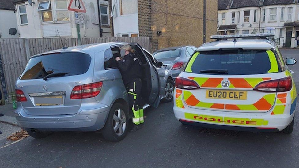 Police deal with a suspected roads offender