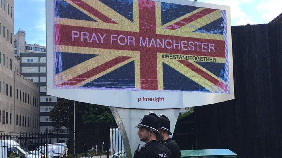 Billboard reading pray for Manchester