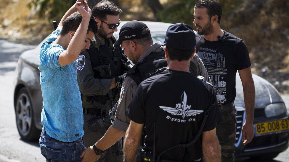 Israeli police carrying out a stop and search on cars leaving the Palestinian neighbourhood of Jabel Mukaber