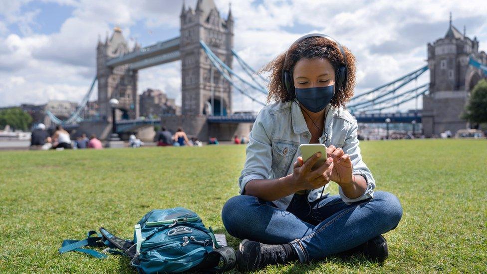 Student sitting by Tower Bridge