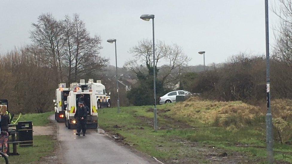 At least four police Land Rovers are attending