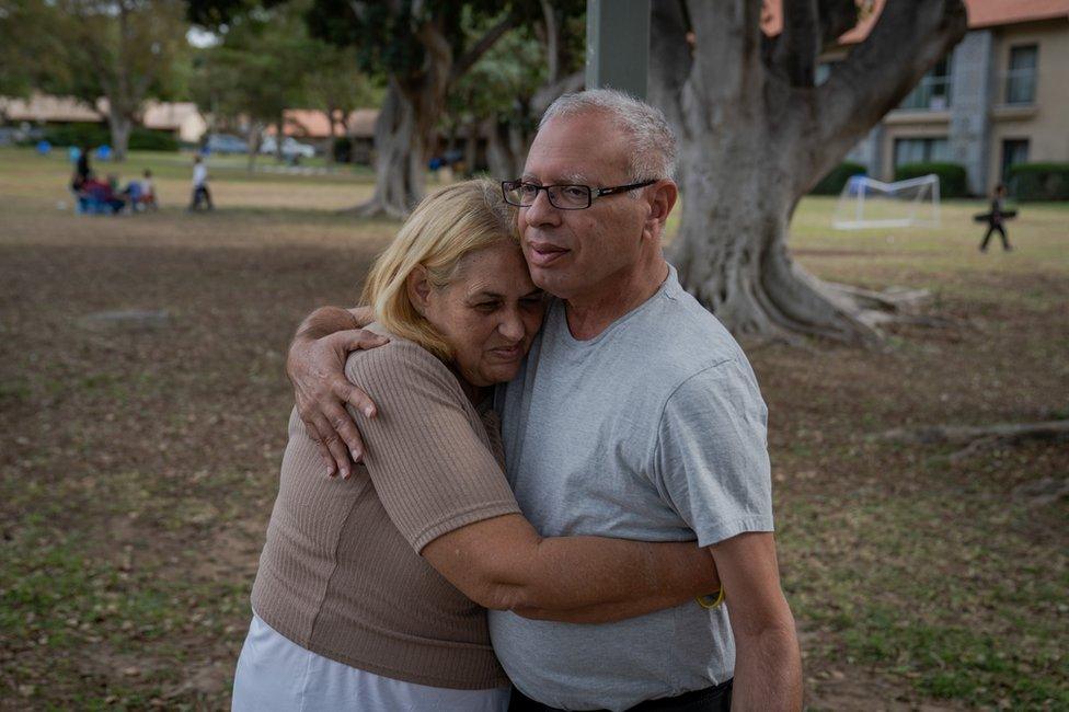 Avi Shamriz, who's son is missing, hugs Steinbrecher, whose daughter Doron is also believed to be in Gaza.