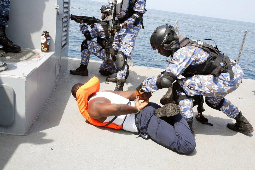 Members of the Ivory Coast Navy take part in a multinational naval exercise off the coast of Abidjan, Ivory Coast, March 27,