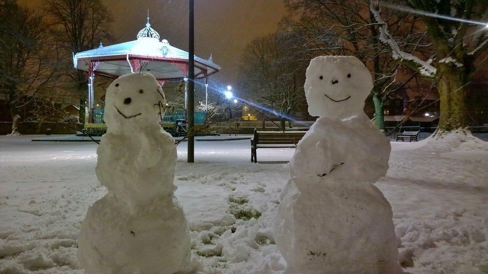 Two snowmen out in the Dock Park in Dumfries