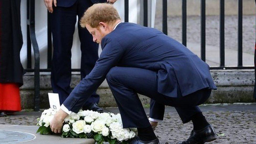 Prince Harry laid a wreath at Westminster Abbey's memorial to innocent victims, with the prime minister looking on