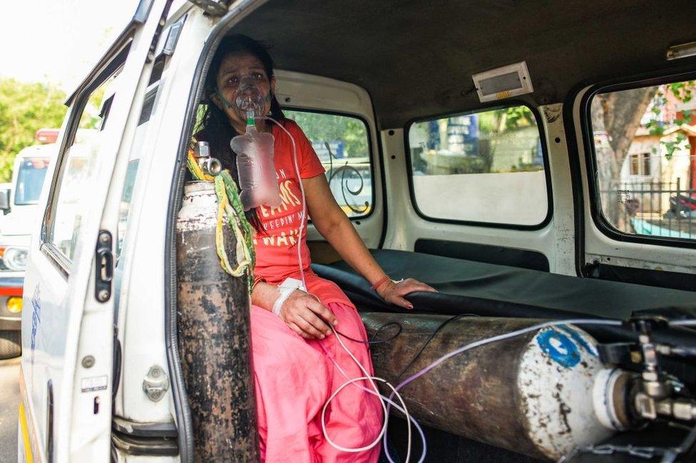 A Covid-19 patient on oxygen support waiting for admission amid a shortage of beds, at LNJP Hospital, on April 22, 2021 in New Delhi,