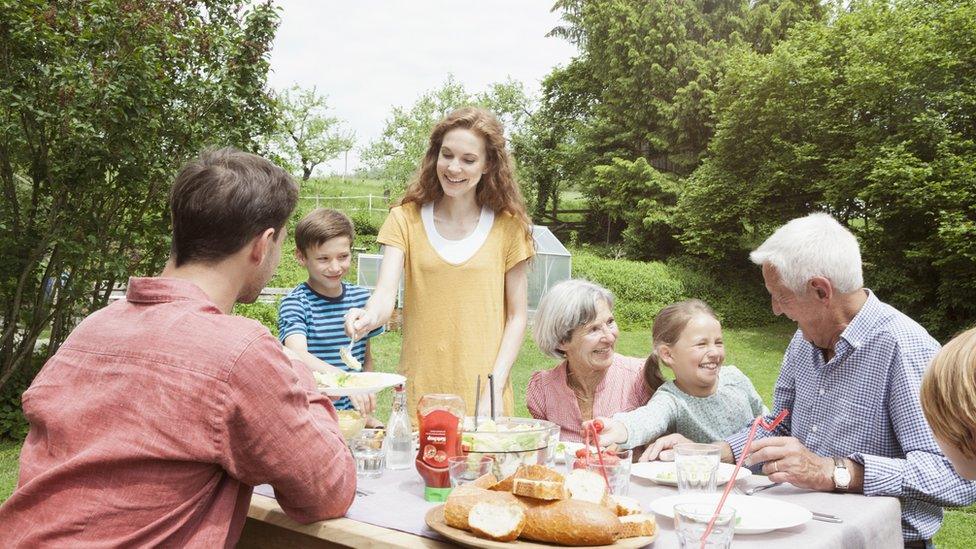 Family having a BBQ.