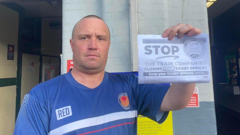 James Beardwell protesting outside of Witham Train Station