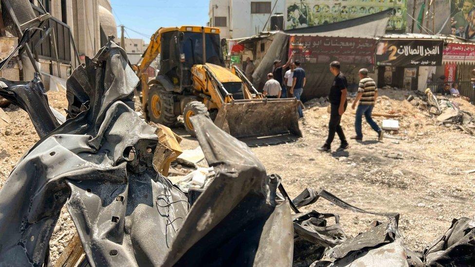 The streets inside Jenin's refugee camp have been decimated shown here by rubble and bent metal