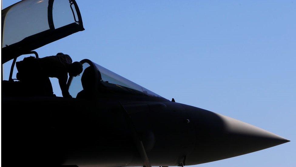 Royal Air Force military mechanic checking a Eurofighter Typhoon fighter