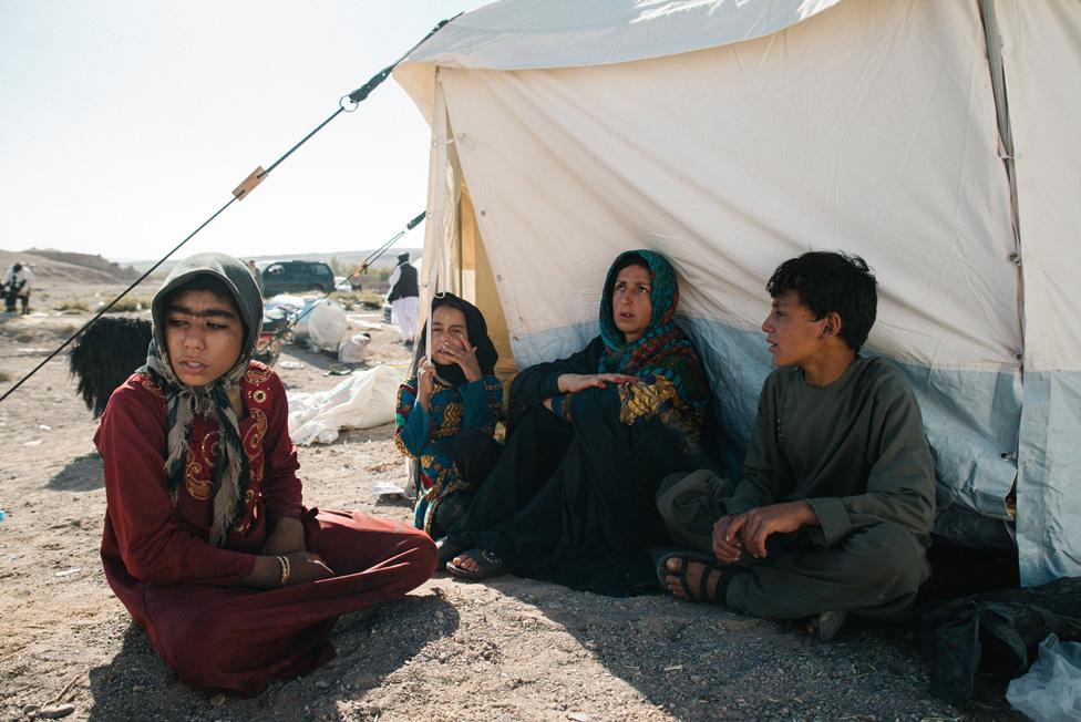 Many survivors, like these residents of Siah Ab, are staying outdoors for fear of more aftershocks