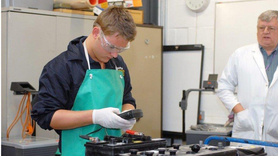 Young man using machine tools