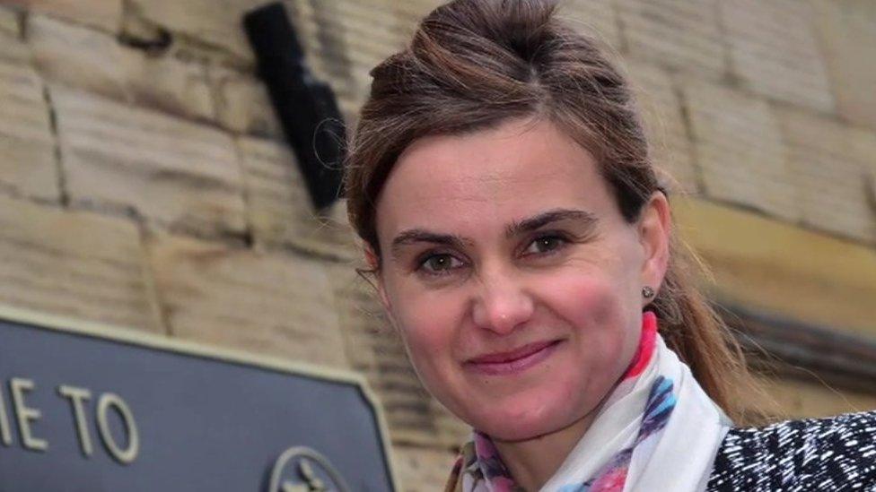 Jo Cox standing next to Batley sign