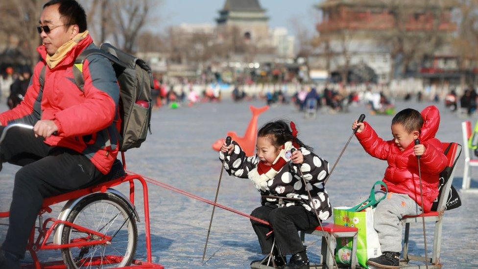 A Chinese man with two children in Beijing