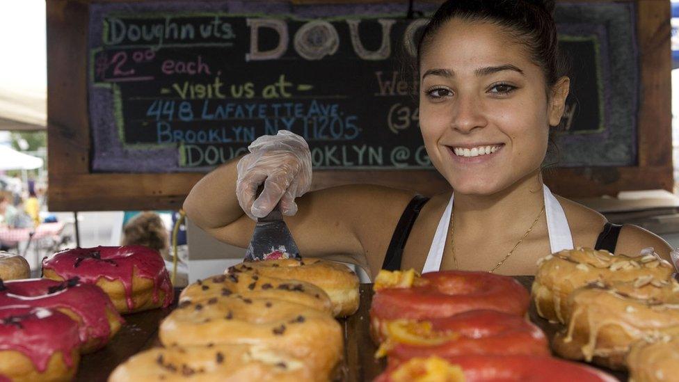 A cake seller at Smorgasburg