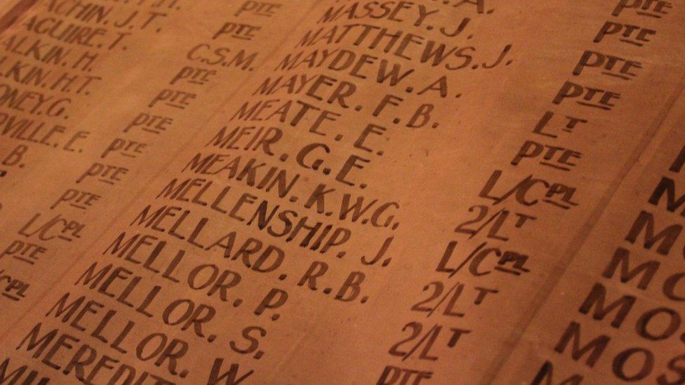 Names of those killed listed on the canvas