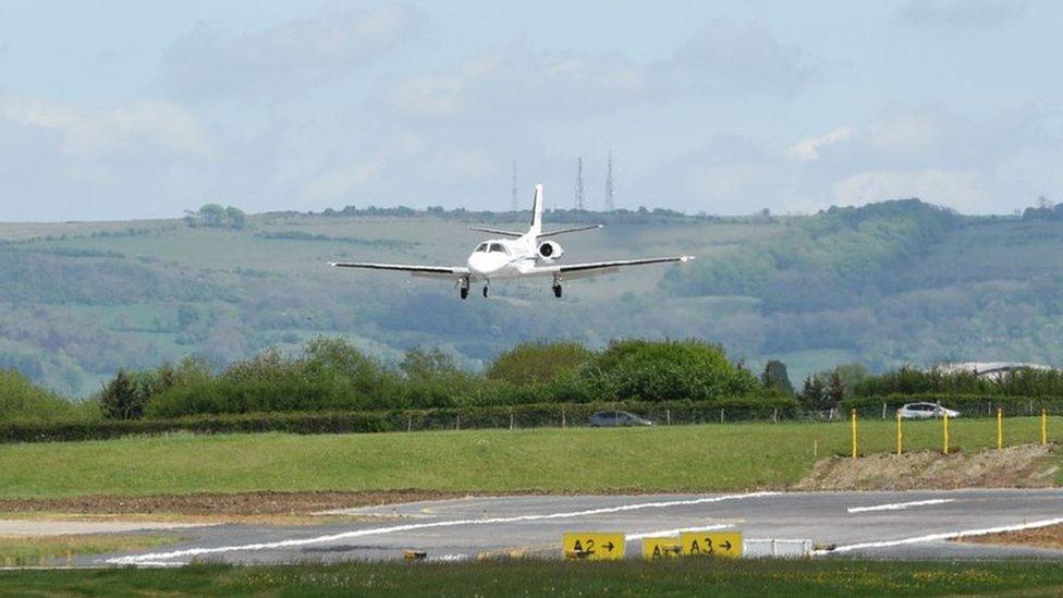 A plane coming in to land on the runway at Gloucestershire airport