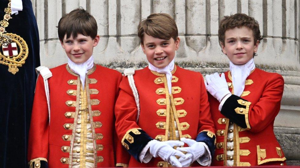 Page of Honour Lord Oliver Cholmondeley, Prince George of Wales, Page of Honour Nicholas Barclay are seen on the Buckingham Palace balcony