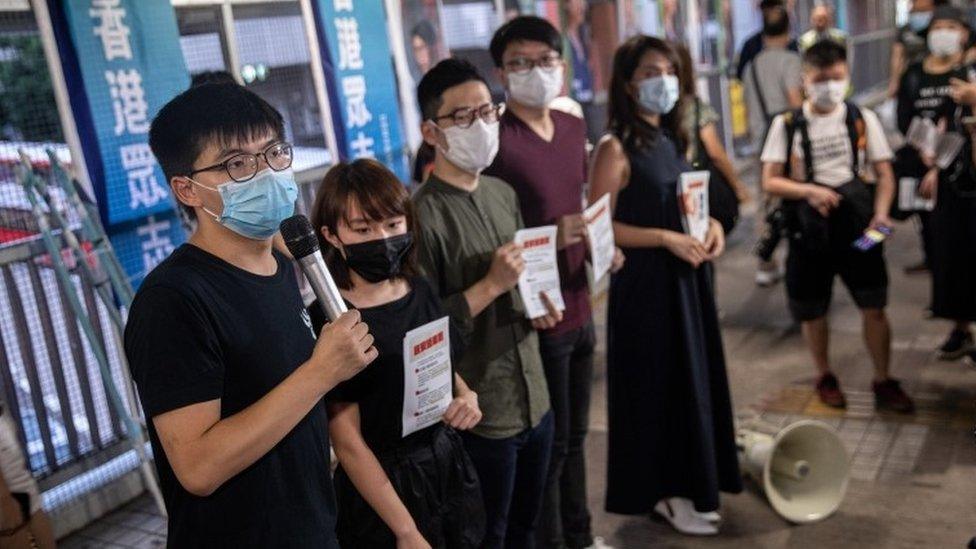 Pro-democracy activists distribute flyers against China's controversial national security law for Hong Kong