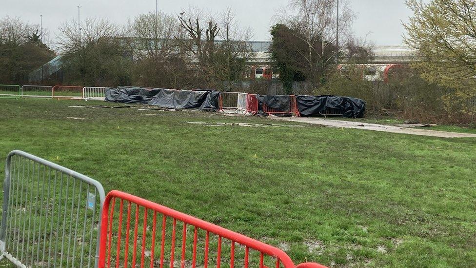 The rugby club pitch is fenced off in many areas with soft and dipping ground