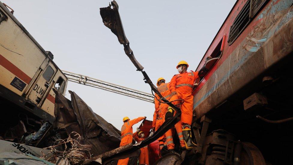 Rescuers searching the wreckage for survivors