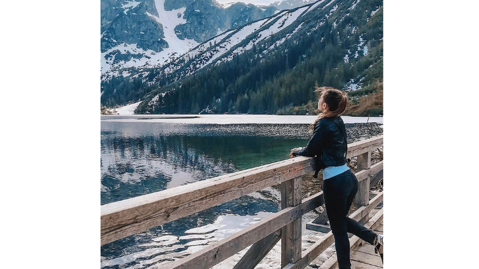 Young girl by mountains