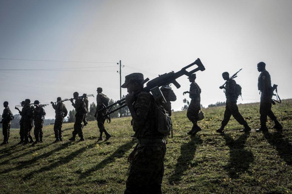 Ethiopian National Defence Forces (ENDF) soldiers walk in line during a training session in the field of Dabat, 70 kilometers Northeast of the city of Gondar, Ethiopia, on 15 September 2021.