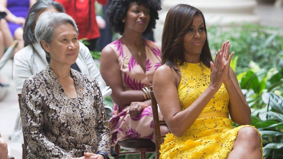 First Lady Michelle Obama and Ho Ching(L), wife of Singapore's Prime Minister Lee Hsien Loong watch a performance by students at the Turnaround Arts Summer Program