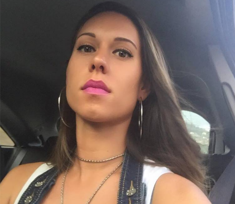 A selfie posted by Elisa Bozzo last year shows her sitting in a car in pink lipstick