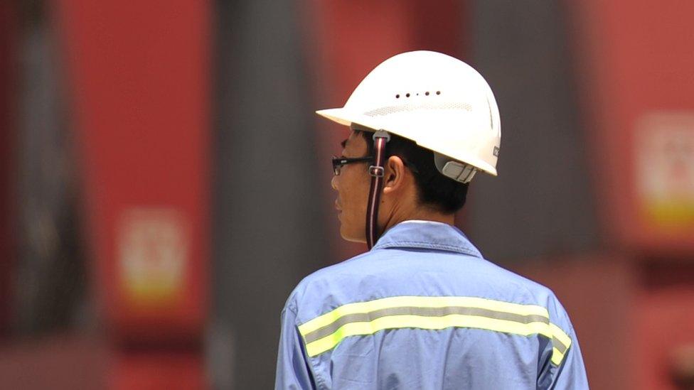 Worker at a port in China