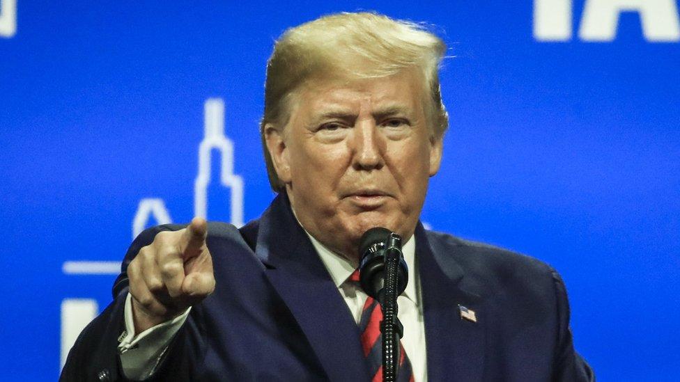 US President Donald Trump addresses the International Association of Chiefs of Police Conference in Chicago, Illinois