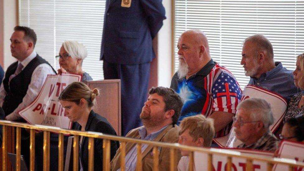 Anti-abortion advocates watch as North Carolina Republican lawmakers hold a vote to override Democratic Governor Roy Cooper's veto on 16 May 2023