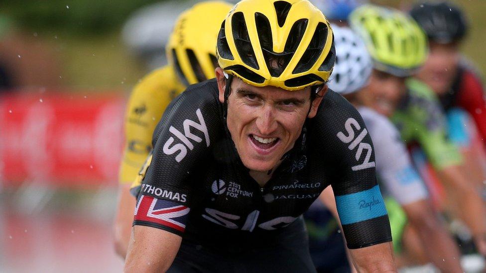 Geraint Thomas leads Team Sky team-mate Chris Froome through a rain-soaked 12th stage