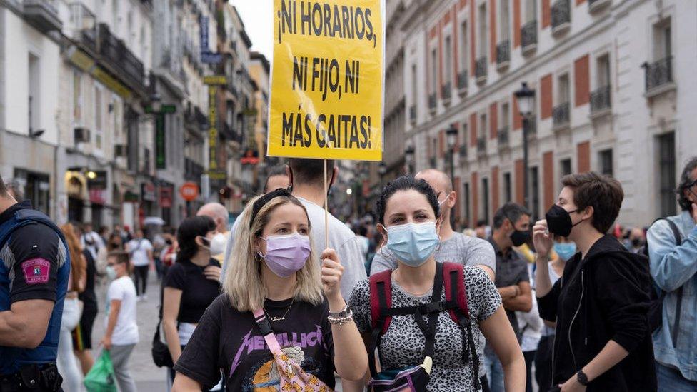 People protesting with banners during a demonstration against the new rise in the electricity bill approved by the government, in Madrid, Spain, on June 5, 2021