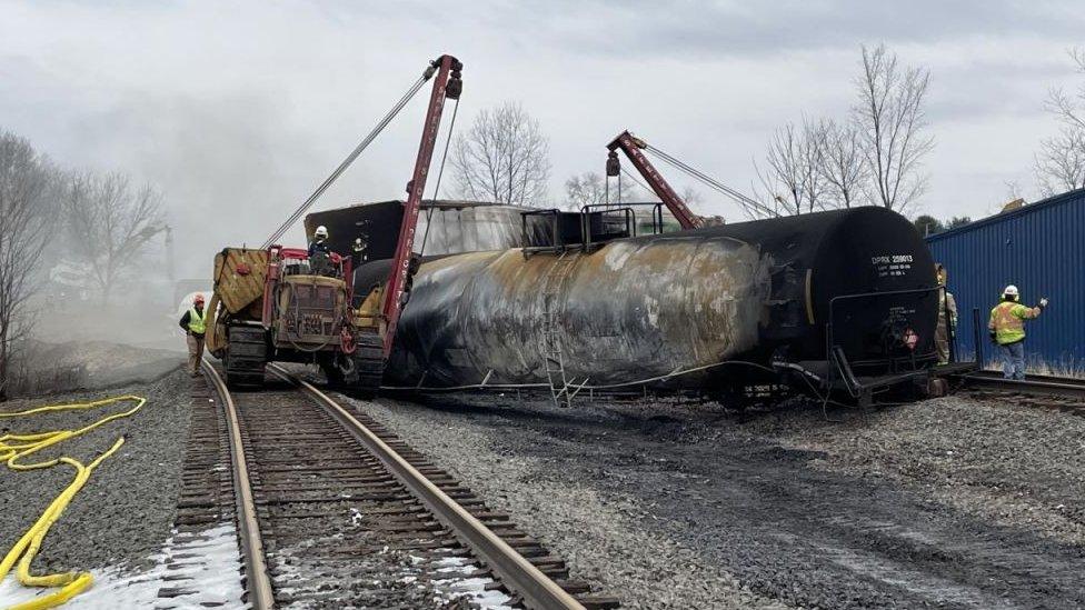 Derailed train car