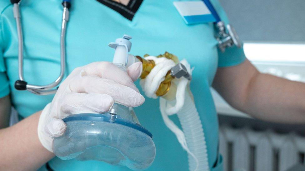 Nurse with oxygen mask